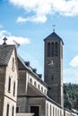 A small church with a tower clock in the old rural village of Rieden Germany