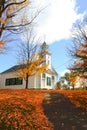 Small church in typical New England town with fall foliage