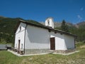 Small church in a village on the mountains Royalty Free Stock Photo