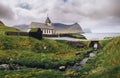 Small village church on the sea shore in Vidareidi, Faroe Islands, Denmark