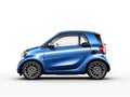 Small city blue mini car Smart Fortwo isolated on white background. Side view Royalty Free Stock Photo
