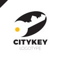 Small city Logo of the builder, house key isolated. Silhouette of the city`s architecture. Vector illustration.