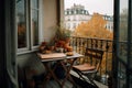 Small city terrace with table and chair in autumn. Town view on background