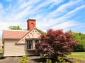 Small Cottage with Brick Chimney Royalty Free Stock Photo