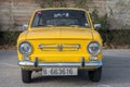 small classic Spanish economy car, the Seat 850 in yellow color Royalty Free Stock Photo