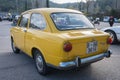 small classic Spanish economy car, the Seat 850 in yellow color Royalty Free Stock Photo