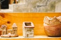 Small clay house model in woodshelf interior decorate Royalty Free Stock Photo
