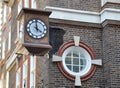 Small clock on a building wall
