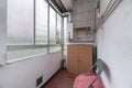 A small closed terrace with a glass window and a gas heater