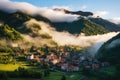 small, cloud-kissed mountain village at sunrise