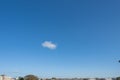 A small cloud over the city scape horizon