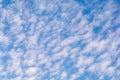 Small clouds and dark blue sky. Royalty Free Stock Photo