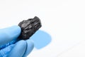 Coal lump in scientist hand Royalty Free Stock Photo