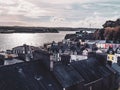 small coastal Irish town of Cobh, urban landscape. Evening cloudy sky over the city. European urban architecture. Aerial view of Royalty Free Stock Photo