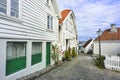 Traditional cobblestone street with wooden houses in the old town of Stavanger, Norway