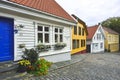 Traditional cobblestone street with wooden houses in the old town of Stavanger, Norway