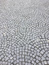Small cobblestones put together in fans, public sidewalk in town Royalty Free Stock Photo