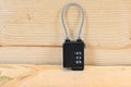 small codelock with wire standing on wooden bench Royalty Free Stock Photo
