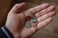 Small coins of Canada lie in the palm of hand. small change in hand Royalty Free Stock Photo