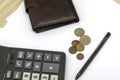 Small coins wallet calculator and fountain pen on sheets of white paper on the table concept business budget economy