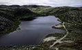 Small cold lake on polar rocky tundra of Teriberka, Kola Peninsula