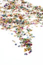 Small color numbers confetti on white