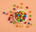 Small colored candies in the ceramic bowl