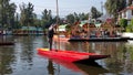 Small, colorful boat being poled at Xochimilco