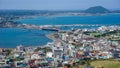 A small and colorful city stretching on both sides of the sea bay at the foot of a high volcano on the South Korean island of Jeju Royalty Free Stock Photo