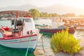 Small colorful greek fishing boats docked in small marina Royalty Free Stock Photo