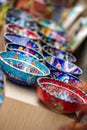 Small colorful pottery bowls in a row Royalty Free Stock Photo