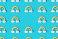 Small colorful rainbow cookie with clouds. Pattern. Copy space