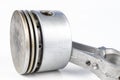 A small combustion engine piston on a white table. Spare parts f Royalty Free Stock Photo