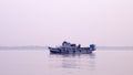 A Small Commercial Fishing trawler nautical vessel on river inland water before heading out to Bay of Bengal. Late evening view