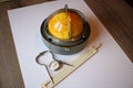 Small compact boat sphere, gauge, stopwatch and slide rule on the table