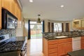 Small compact kitchen room with light wood cabinetry