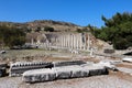 Small and cosy ancient roman theatre with the ruins of temple with row of columns in archaeological site Pergamon in Turkey Royalty Free Stock Photo