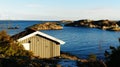 Small cottage fishing near fjord Royalty Free Stock Photo