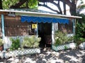 Small cottage house in Hawaii with planters in front