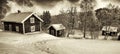 Small cottages in old rural winter landscape Royalty Free Stock Photo