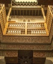 Small courtyard serving the student dormitories with wood carving in madrasa Ben Youssef Madrasa in Marrakesh, Morocco Royalty Free Stock Photo