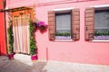 Small, cozy courtyard with colorful cottage / Burano, Venezia / The small yard with bright walls of houses