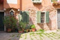 View of the Small, cozy courtyard with colorful cottage / Venice/ The small yard with bright walls of houses
