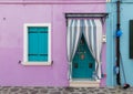 Small, cozy courtyard with violet cottage / Burano, Venice/ The small yard with bright walls of houses