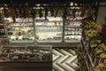 Small cozy grocery store with refrigerators and chilled food in them. Vegetables and fruits, meat and milk. View from above.