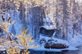 A small and cozy wintery cabin in the middle of Finnish taiga forest Royalty Free Stock Photo