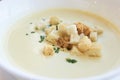 Small crackers. Delicious cheese soup. White dishes Royalty Free Stock Photo