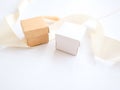 Small craft boxes for packing jewelry on a white holiday background. The concept of packaging, holiday, gifts. Place for
