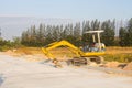 Small crawler Excavator digging bucket on construction of high-speed bypass road to Laemchabang Port Royalty Free Stock Photo