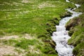 Small creek in field